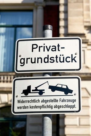 Parking ban in Magdeburg in Germany. Translation: private property, parked vehicles will be towed away for a feeの写真素材