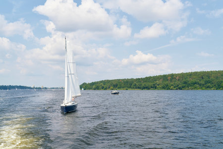 Berlin, Germany â July 17, 2021: A sailing ship on the Havel river near Berlin. In the background the district of Spandau.のeditorial素材
