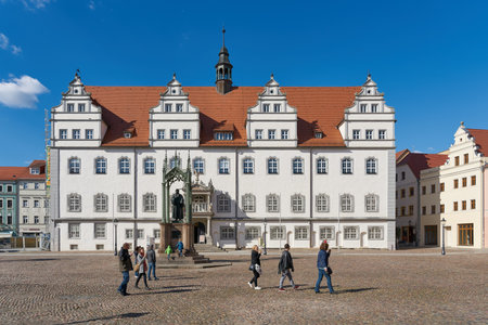 Wittenberg, Germany â April 17, 2022: City Hall of Wittenberg with the monument of the reformer Martin Luther standing in front of itのeditorial素材