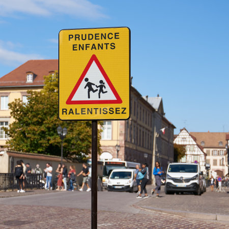 Colmar, France - August 31, 2022: Sign in France with the inscription Prudence Entfants Ralentissez. Translation: caution children, drive slowlyのeditorial素材