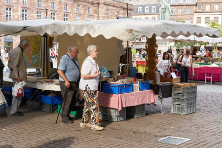 Strasbourg, France â August 30, 2022: Flea market with visitors on a market place in the old town of Strasbourg in Franceのeditorial素材