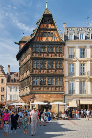 Strasbourg, France â August 30, 2022: Historic half-timbered house and tourists from all over the world on the busy Place de la CathÃ©drale in Strasbourg, Franceのeditorial素材