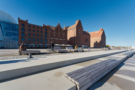 Stralsund, Germany â October 30, 2023: listed storehouses and the promenade at the port of Stralsund in Germanyのeditorial素材