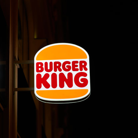 Prague, Czech Republic â October 01, 2023: Illuminated sign for the fast food chain Burger King in the center of Prague at nightのeditorial素材