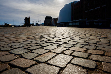 Cobblestones with strong backlit in the sunset in the harbor of Stralsund in Germanyの写真素材