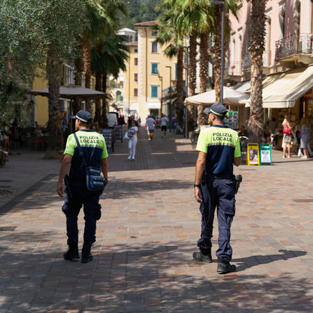 Riva del Garda, Italy â August 03, 2023: Police presence for public safety in the popular vacation resort of Riva del Garda on Lake Garda in Italyのeditorial素材