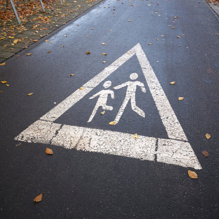 Indication of pedestrians by a road marking on the Sundpromenade in Stralsund, Germany