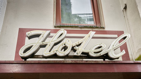 Retro neon sign for a hotel in the city center of Cologne in Germanyの写真素材