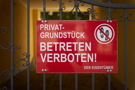 Sign with the German inscription PrivatgrundstÃ¼ck, Betreten Verboten. Translation: Private property No trespassingの写真素材