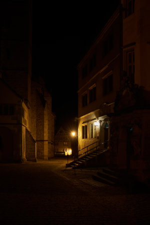 Night scene at St. Jacob's Church, St-Jakobs-Kirche on the church square, Kirchplatz in Rothenburg ob der Tauber in Germanyの写真素材