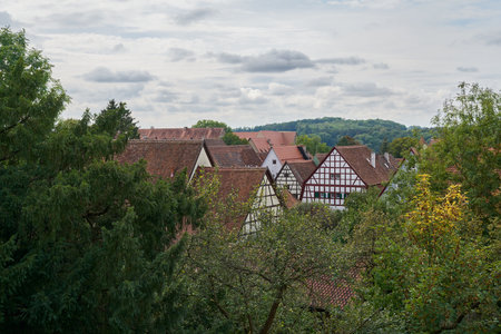 View from the old town wall of lovingly renovated half-timbered houses in Rothenburg ob der Tauber in Germanyの写真素材