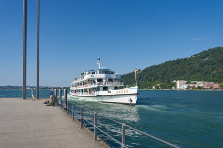 Bregenz, Austria â€“ August 18, 2025: The motor ship Baden, built in 1935, entering the port of...