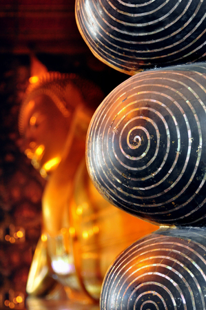 Bangkok, Thailand - View of the landmark Reclining Buddha statue in Wat Pho temple, close up of the feetの写真素材