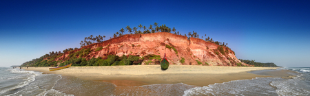 India, Kerala - Varkala South Cliff and beach with colorfull traditional fisherman boatsの写真素材