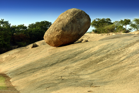 Krishna's butter ball, the giant natural balancing rock in Mahabalipuram, Tamil Nadu, Indiaの写真素材
