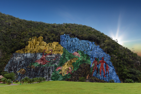 sunrise at the Mural de la Prehistoria, a giant mural painted on a cliff face in the area of ??Cuba Vinalesの写真素材