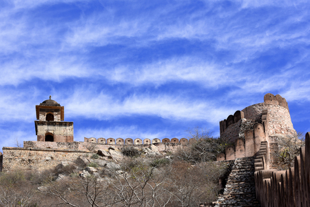 ancient watchtower in the great indian wall overlooking the city of Amer near the Amber Fort, Radjasthan, Jaipur, Indiaの写真素材