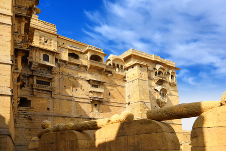 towers of historical Jaisalmer fort with monumental stone walls in old desert Thar city, Rajasthan, Indiaの写真素材