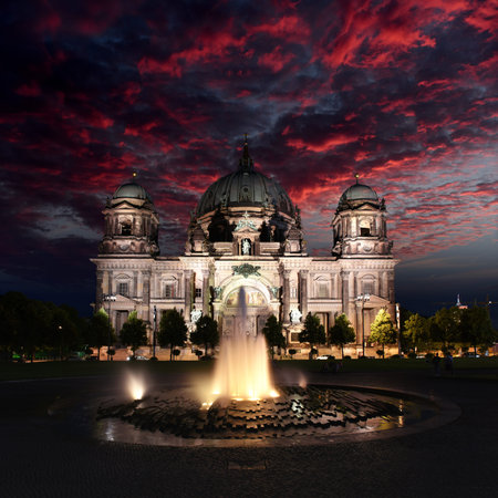 Berlin Cathedral illuminated by colorful lights during sunsetの写真素材