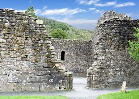 Glendalough cemetery, Ireland, ancient monastery in the Wicklow mountains with a beautiful graveyard from the 11th centuryの写真素材