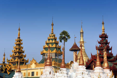 detail view to a group of golden stupas at the Shwedagon Pagoda in Yangoon, Myanmar (Burma)の写真素材