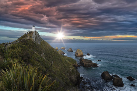 panoramic view to the Nugget Point Lighthouse, located in the Catlins area on the Southern Island Coast of New Zealand, Otago regionの写真素材