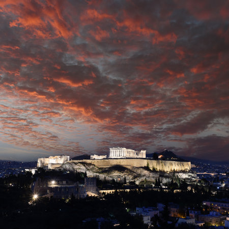 Panorama of Acropolis hill at night, Athens, Greece. Famous old Acropolis is a top landmark of Athens. Ancient Greek ruins in the Athens center at duskの写真素材