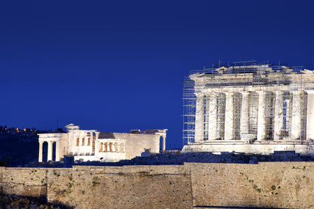Panorama of Acropolis hill at night, Athens, Greece. Famous old Acropolis is a top landmark of Athens. Ancient Greek ruins in the Athens center at duskの写真素材