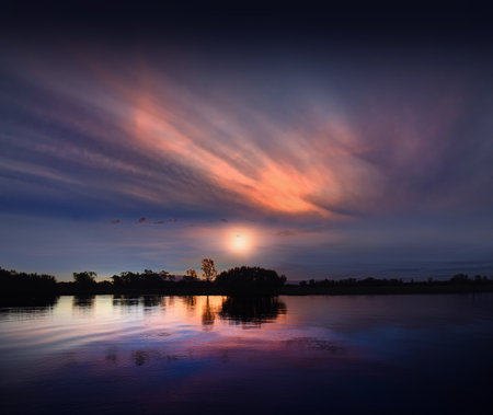 spectacularly and colorful sunset at Yellow Waters Billabong, Kakadu National Park, Northern Territory, Australiaの写真素材