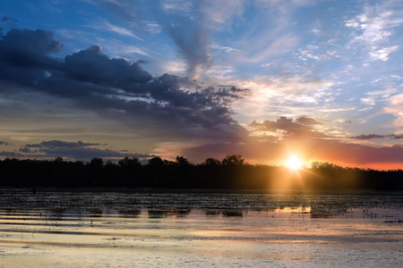 spectacularly and colorful sunset at Yellow Waters Billabong, Kakadu National Park, Northern Territory, Australiaの写真素材