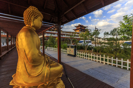 Golden buddha statue in a Chinese templeの写真素材
