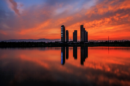 lakeside building under sunsetの写真素材