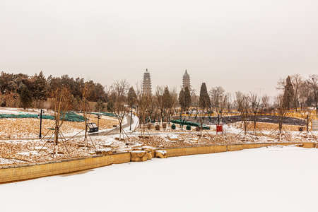 Winter Snow Scenery of Twin Pagodas in Yongzuo Temple, Shanxi, Chinaの写真素材