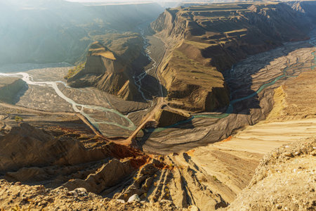 Aerial view of the canyon with a river in the background.