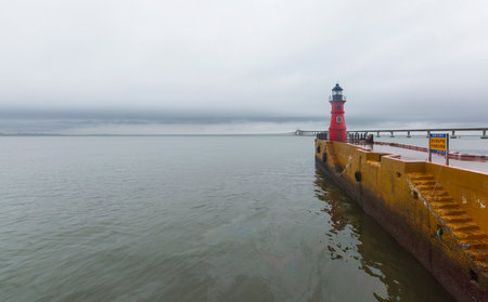Lighthouse at the entrance to the Baltic Sea in the fog.の写真素材