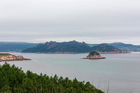 Beautiful seascape of sea and mountains in cloudy day.の写真素材