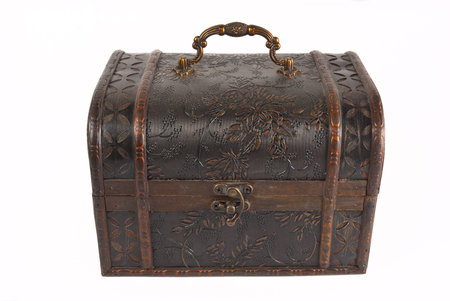 Brown old chest with intricate details, isolated on a white background