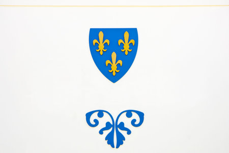 Blue and yellow emblem on a white wall