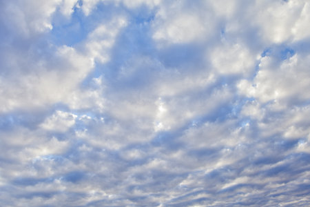 White clouds filling the frame with deep blue skies in the background