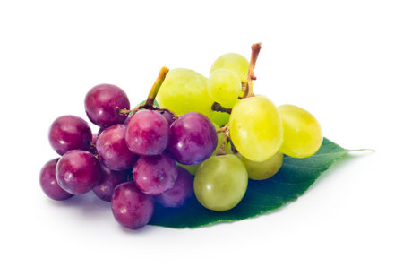 red and green grapes isolated on whiteの写真素材