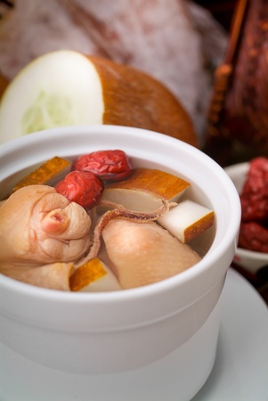 Chicken and herb soup in pot, Chinese food styleの写真素材