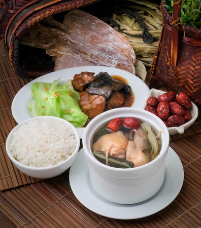 Chicken and herb soup in pot, Chinese food styleの写真素材