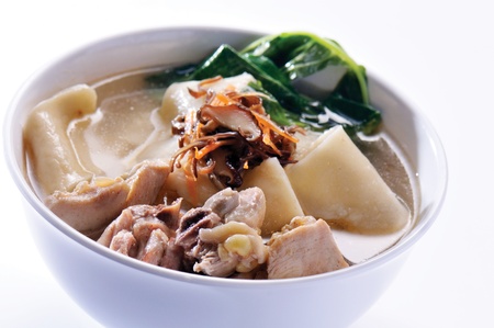 Chicken and herb soup in pot, Chinese food styleの写真素材