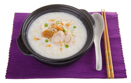 Porridge, abalone & chicken Porridge (congee) served in claypotの写真素材