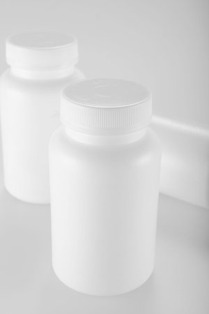 White medicine bottle on white background