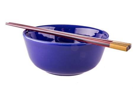 Japanese chopsticks on a bowlの写真素材