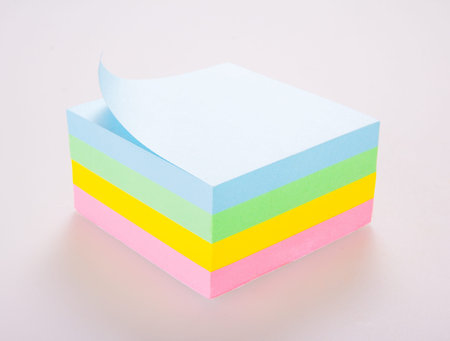 Block of vibrant multicoloured Post it Notes