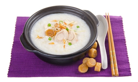 Porridge, abalone & chicken Porridge (congee) served in claypotの写真素材