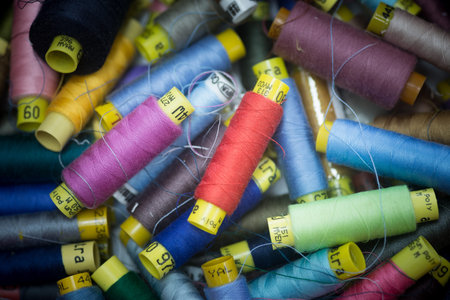 spools  many colorful spools of thread for sewing, colorful background