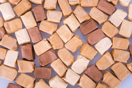 candies. caramel candies. caramel candies on a background. caramel candies on a background.の写真素材